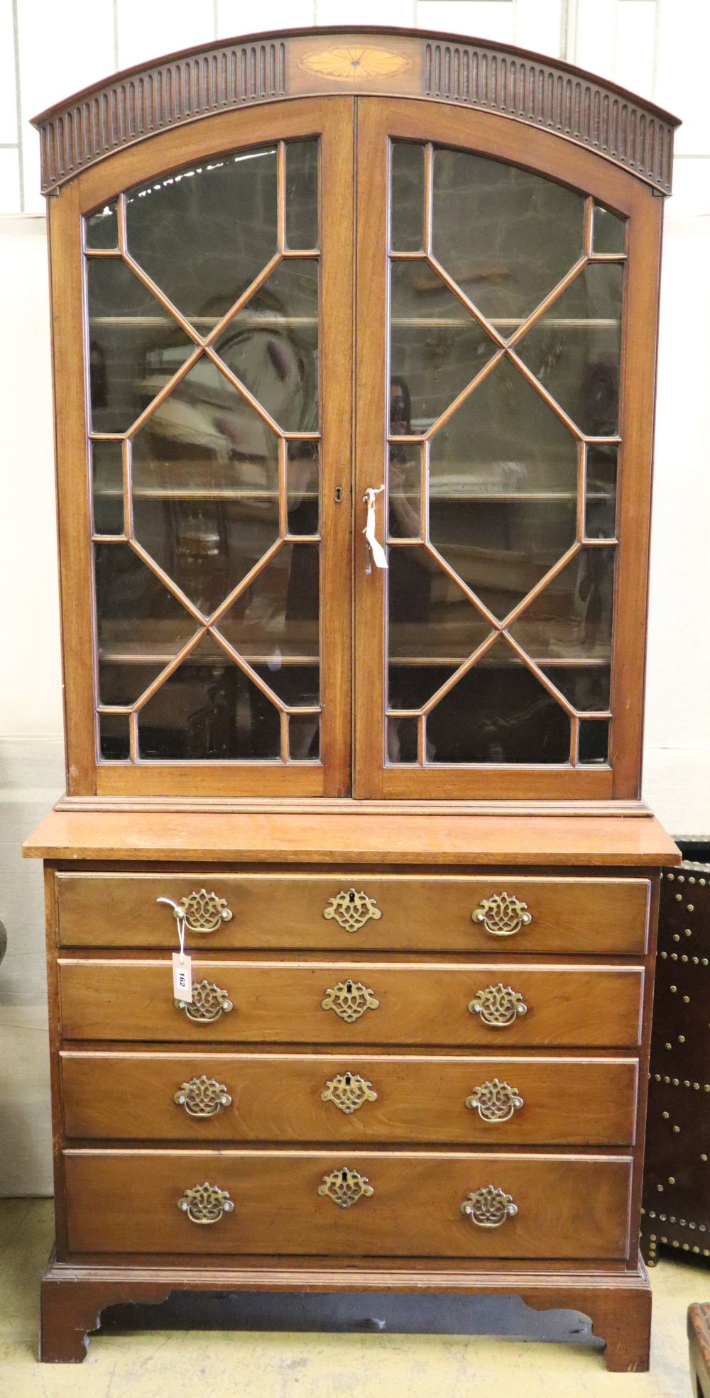 A mahogany chest of drawers with bookcase top, W.96cm, D.47cm, H.202cm